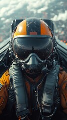 Fototapeta premium Pilot wearing an orange flight suit and helmet sits inside an aircraft cockpit, with a blurred aerial view outside