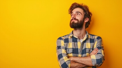 Fototapeta premium Confident man against yellow backdrop