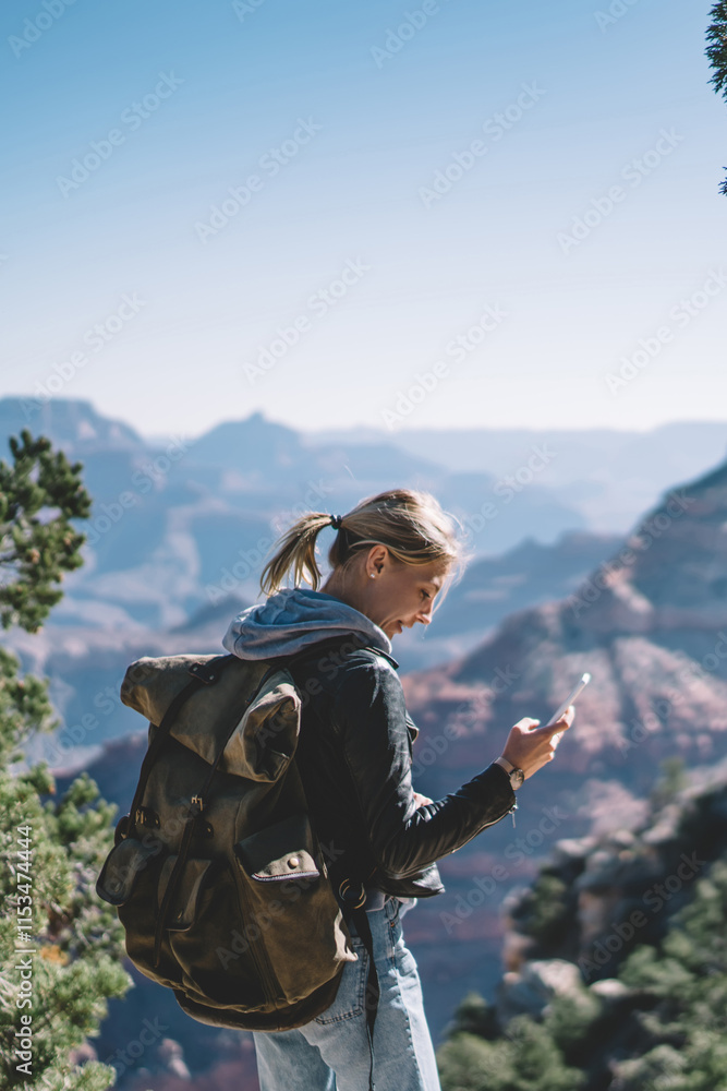 Aufkleber smiling female tourist with backpack satisfied with having roaming mobile connection for communicati