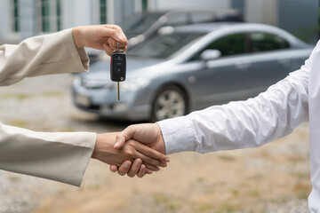 lease, rental car, sell, buy. Dealership manager send car keys to the new owner.  Sales, loan credit financial, rent vehicle, insurance,  renting, Seller, dealer, installment, car care business