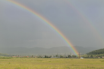 Country road and double rainbow