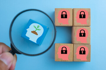 Magnifying glass focus on Growth mindset among fixed mindset highlighting personal development,...