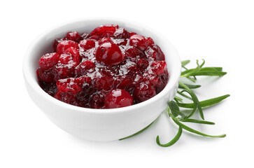 Tasty cranberry sauce in bowl and rosemary isolated on white