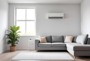 A white air conditioning unit mounted on the wall in a living room with a gray sofa and a potted plant in the foreground, with natural light coming in through a window