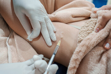 Medical specialist injecting syringe bacterial toxin botulin into armpit for reduce body odor and wrinkles