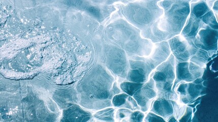 Obraz premium A close-up photo capturing clear water in a relaxing swimming pool, offering a refreshing summer ambiance perfect for holiday vacation imagery with copy space.