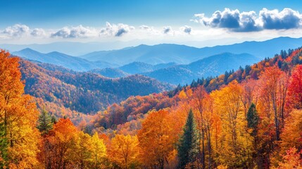 Fototapeta premium A vibrant autumn landscape showcasing colorful trees and rolling mountains under a clear blue sky.