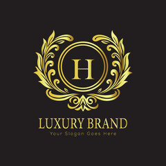 Letter H Luxury brand logo design with a royal gold crown emblem and elegant typography
