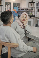 Obraz premium romantic muslim husband and wife face to face each other at home
