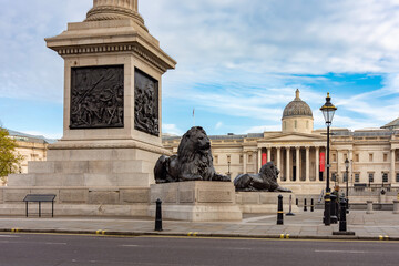 Trafalgar square with Nelson monument lions and National Gallery, London, UK