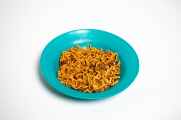 Indomie fried noodles on white background isolated.