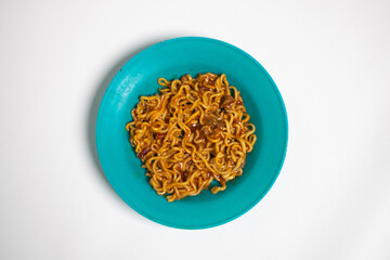 Indomie fried noodles on white background isolated.
