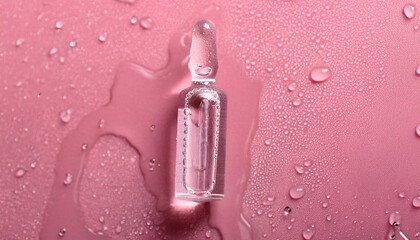 Cosmetic glass ampoule on wet pink background. Hyaluronic acid injections, botulinum, botox.