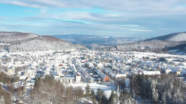 Drone aerial view of the town of Delnice in Gorski kotar in winter under snow, Croatia