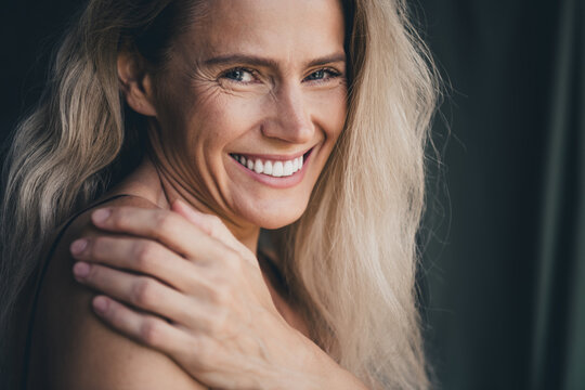 No filter studio photo of sweet pretty woman wear lingerie loving embracing herself isolated khaki textile background