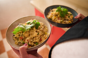 Delicious vegetable paella bowls served and garnished with fresh herbs