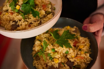 Homemade vegetable paella served in bowls with fresh parsley garnish
