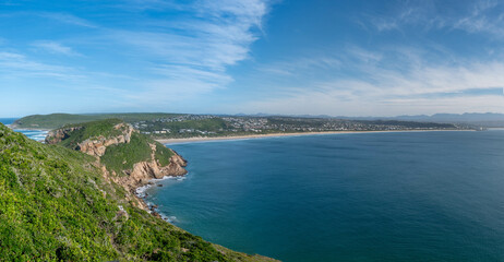 A view of a beautiful coastline with mountains and a beach at Robberg nature reserve along the Garden route, Plettenberg Bay, Western Cape province, South Africa, Africa