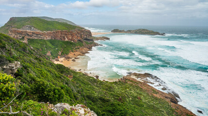 A view of the peninsula and coastline with waves and beach at Robber nature reserve along the Garden route, Plettenberg Bay, Western Cape province, South Africa, Africa 