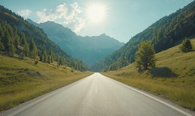 Fototapeta premium A scenic road stretching through mountains under a bright sun.
