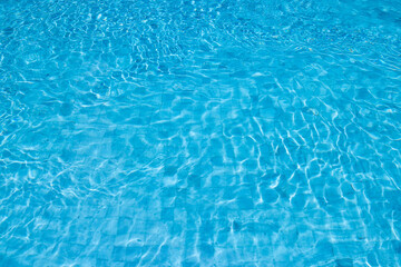 Obraz premium Blue Water Pool Surface with Sunlight Reflections