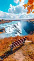 Obraz premium Autumn Waterfall Vista, Serene Bench Overlooks Majestic Cascades