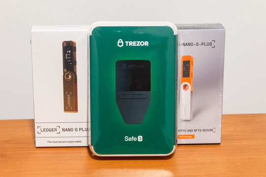 Pruszcz Gdanski, Poland - December 21, 2024: Boxes with Ledger Nano S Plus- Retro Gaming and Ledger Nano S Plus- BTC Orange and Trezor Safe 3. Ledger and trezor are hardware crypto wallets.