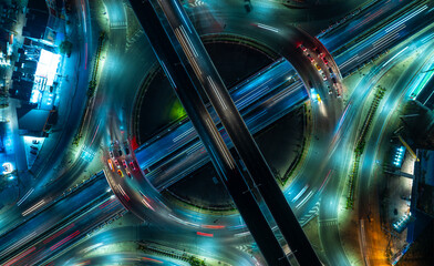 Expressway top view, Road traffic an important infrastructure, car traffic transportation above intersection road in city night