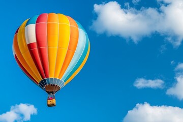 Naklejka premium An HDR close-up of a colorful hot air balloon with detailed stitching and vibrant panels against a bright blue sky