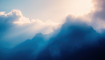 Fototapeta premium the clouds in the mountains with a bright sun