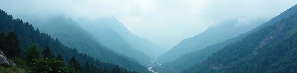 Obraz premium Valley shrouded in thick fog with distant mountains visible, foggy hills, mysterious atmosphere