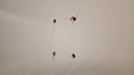 Screw holes on a house wall inside