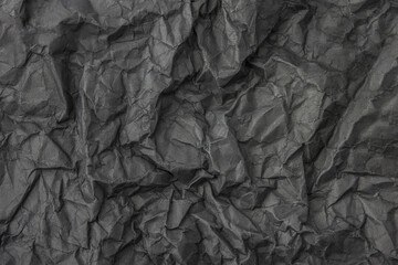 Abstract dark gray crumpled paper texture background