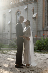 A Romantic Wedding Kiss Captured in Soft, Radiant Light That Envelops the Couples Affection