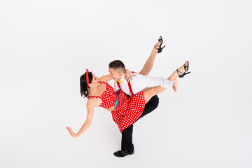 Photo of attractive couple professional choreographers dancing rock roll jazz fusion isolated on...