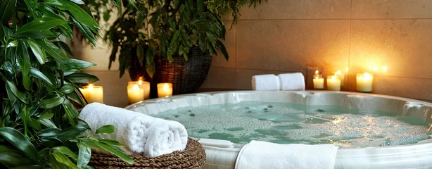 Fotobehang A luxurious spa room featuring a bubbling jacuzzi aroma Luxurious spa with bubbling jacuzzi Relaxing spa retreat with soothing aroma Elegant spa room with jacuzzi ambiance © Adul