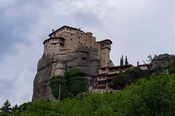 View of Meteora monasteries and the rock formations in the mountains of Greece. Unesco world...