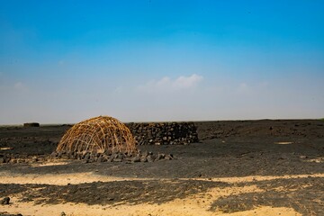 Afar nomad hut in the remote volcanic desert of the Danakil depression in Ethiopia