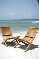 Serenity by the Sea: Bamboo Beach Chairs on Pristine White Sand with Gentle Waves