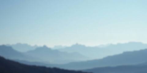Fototapeta premium Serene Blue Mountain Range at Dawn A Hazy, Out-of-Focus Landscape Image