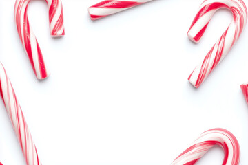 Fototapeta premium Christmas theme candy cane background with blank space in the middle, Selective focus candy cane in Christmas isolated on white background.