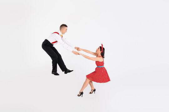 Photo of attractive couple professional dancers dancing samba rumba performance isolated on white color background