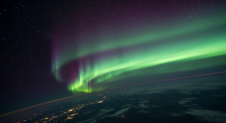 A vibrant aurora borealis seen from a space station orbiting Earth.