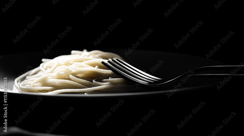 Poster delicate strands of spaghetti elegantly arranged on a plate with a fork resting beside them in low l
