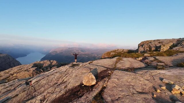 Diving a beautiful mountain crest over Rambergstranda Beach at sunset, Lofoten Islands in Norway. Preikestolen.