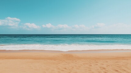 Fototapeta premium Serene beach scene with clear blue ocean, white waves, and sandy shore under a bright sunny sky.