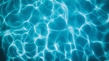 This image captures the mesmerizing patterns of light and movement in clear blue water, illustrating the beauty of aquatic environments and the calming nature of water reflections.