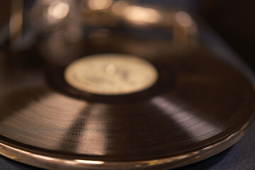 old record close up. Record player with vinyl disk in living room. vintage