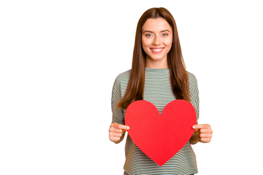 Photo of nice beautiful charming enchanting girl holding red heart of love in order to celebrate her boyfriend while isolated with yellow background