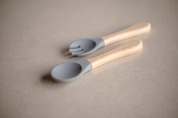 Baby spoon and fork made of silicone and wood